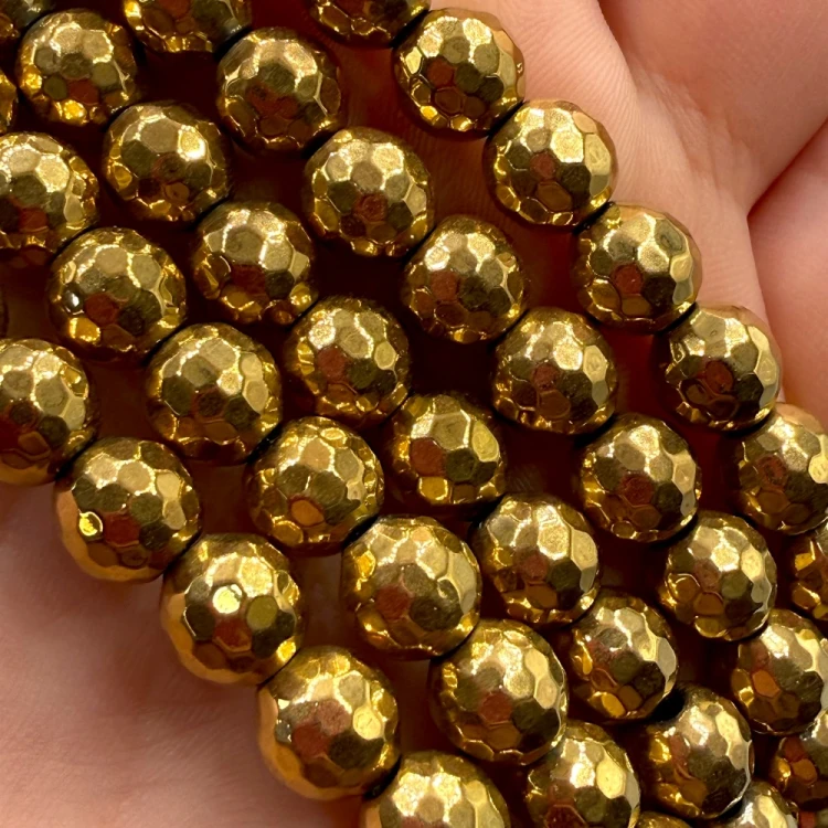 Hematyt kulka fasetowana / kolor ciepłe złoto / ok. 8mm